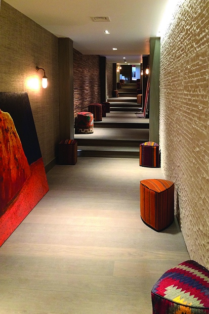 Silk wall covering complementing the wood slat covering